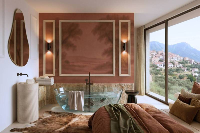 Salle de bain ouverte sur chambre avec grande baie vitrée offrant une vue panoramique sur Propriano en Corse, design moderne et haut de gamme.